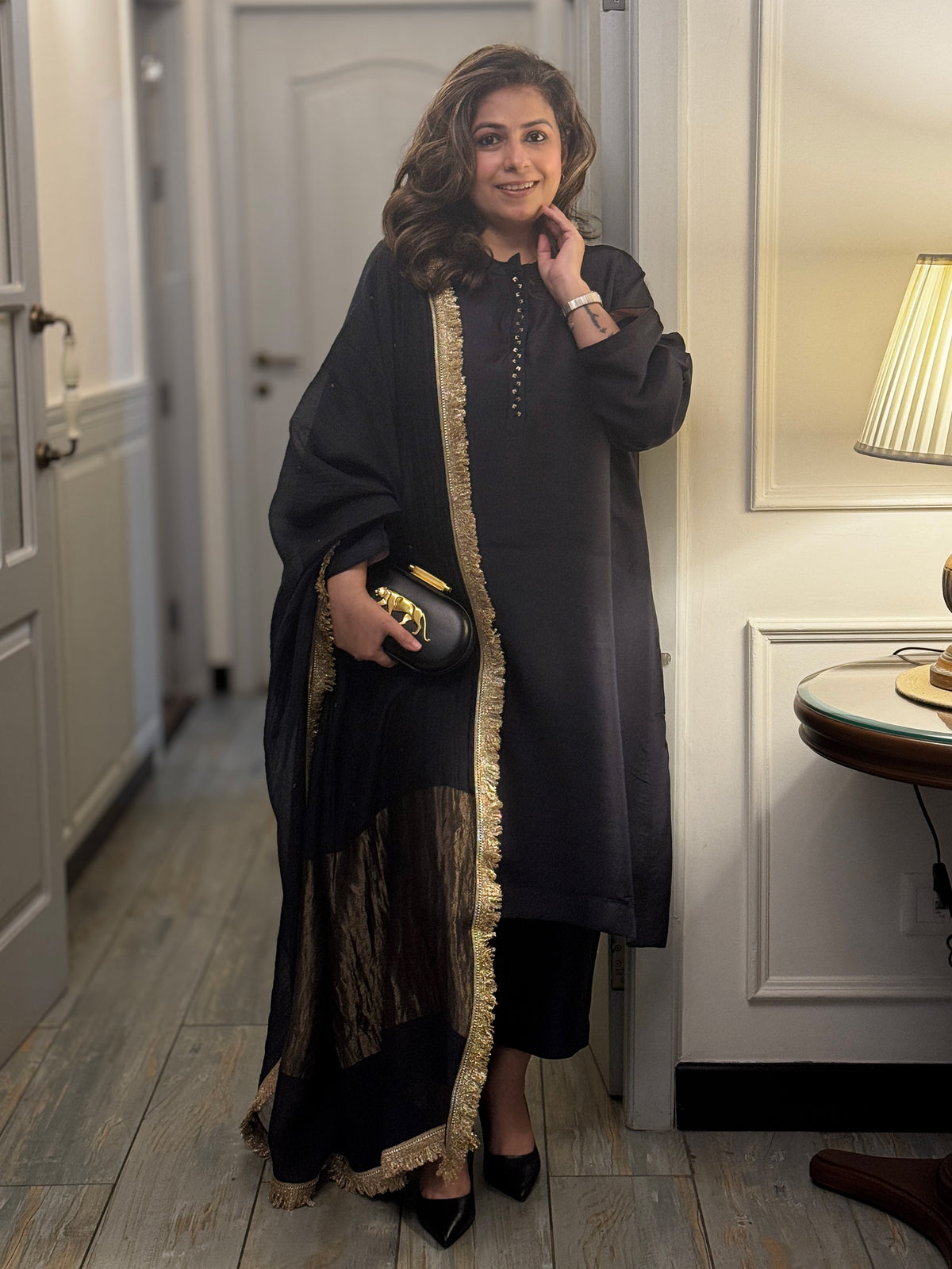 Featuring MuddnMe's dark black traditional silk kurta with gold trim on placket. Paired with Dupatta.