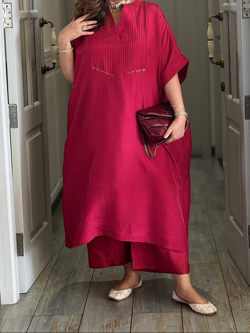 A women wearing red pur silk kurta. Hand embroidered Kurta for Women
